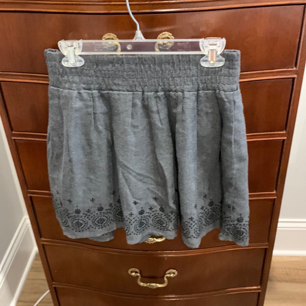 Grey skirt with black pattern at hem